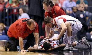 Luke Hancock comforts Kevin Ware