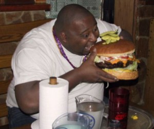 man eating a hamburger