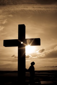 Praying before the cross